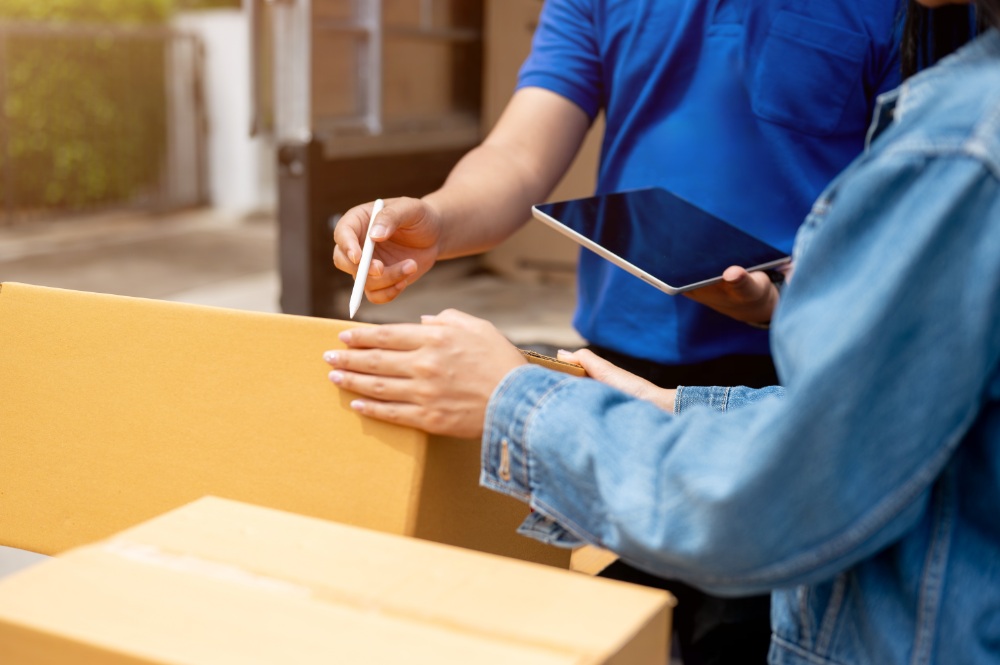 Signing for a package delivery