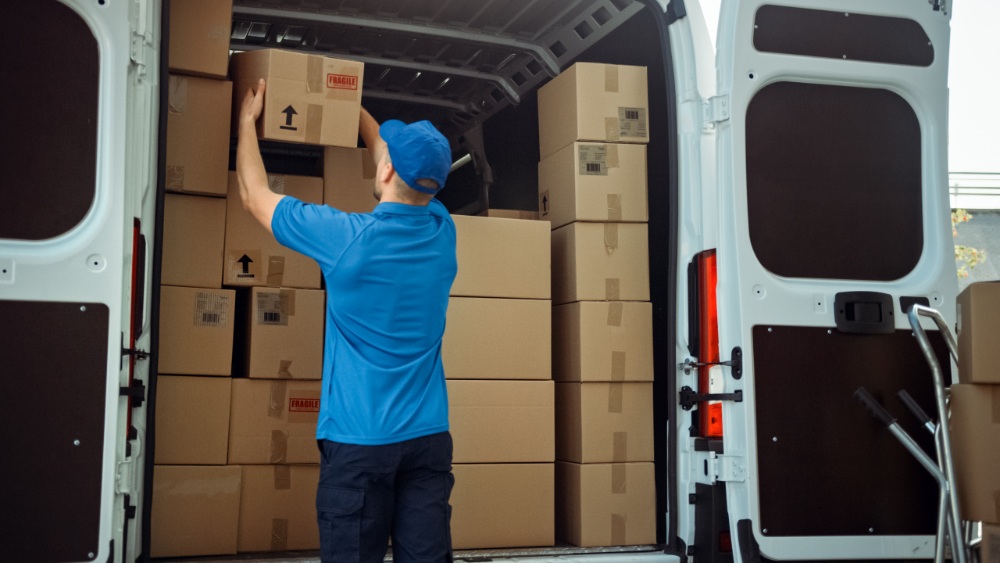 Person loading boxes in van