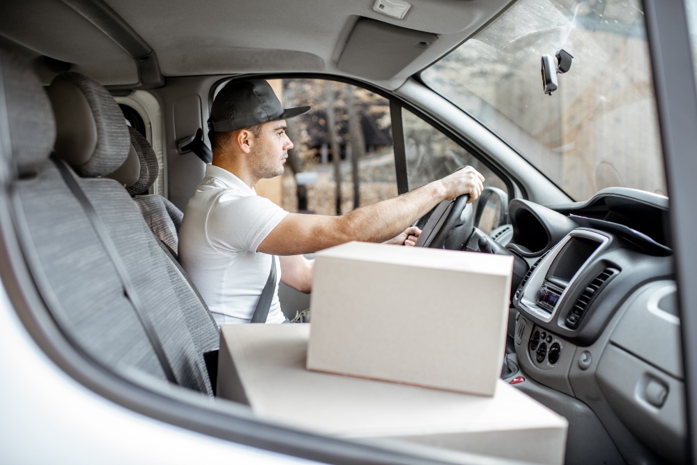 Man driving van with packages